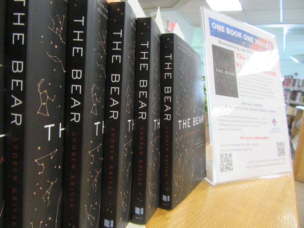 Photo of several print copies of the book The Bear by Andrew Krivak. 