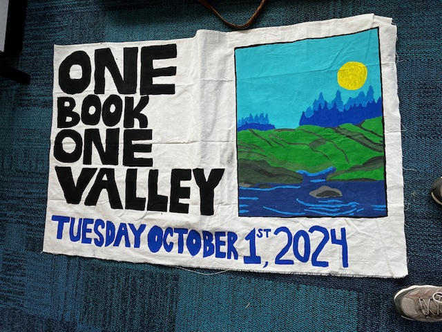 photo of hand-painted banner for the October 1, 2024 fundraiser